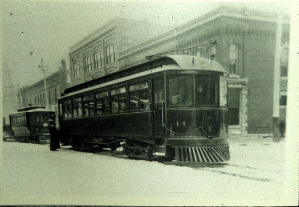 Trolley in front of the Malcolm Building in Oskaloosa, Iowa.