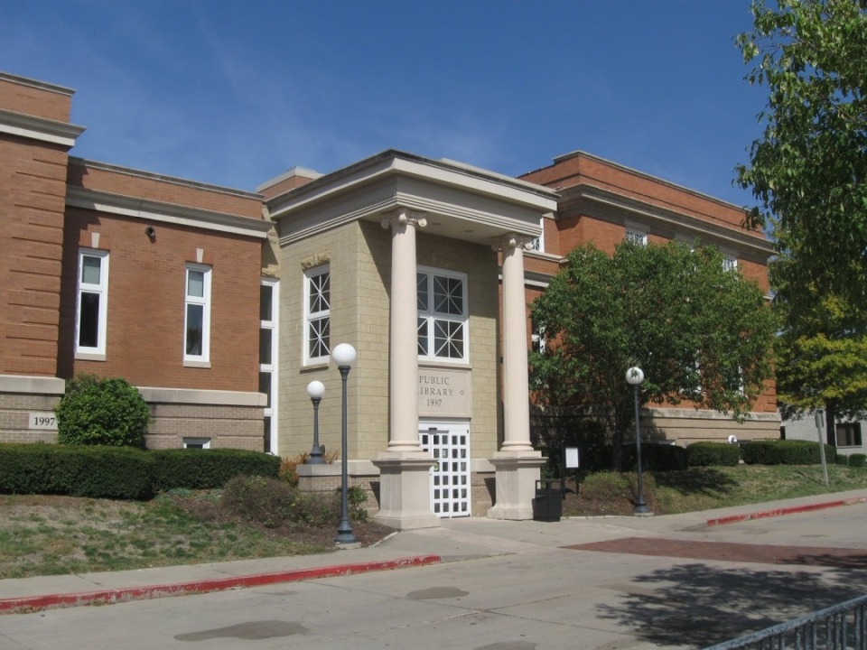 The Oskaloosa Public Library entrance with Grecian columns.